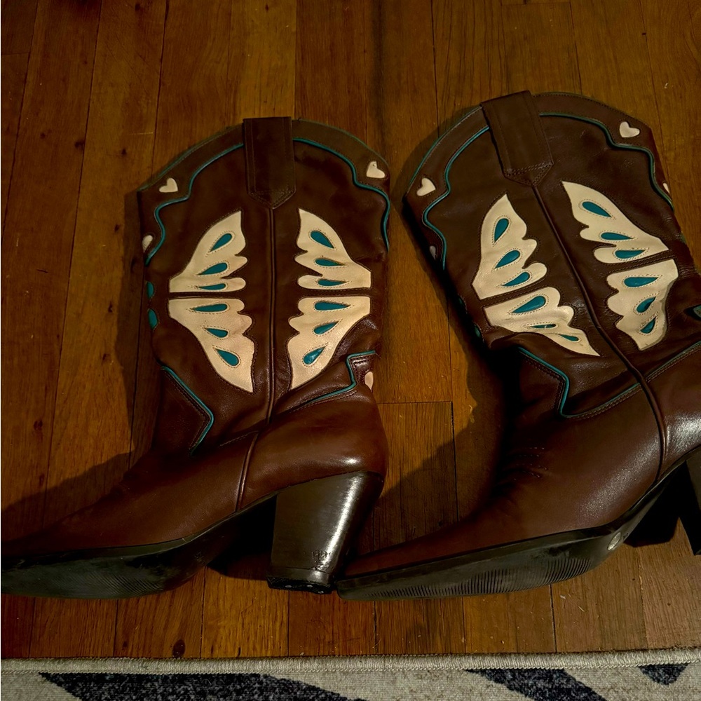 Brown leather cowboy boots.